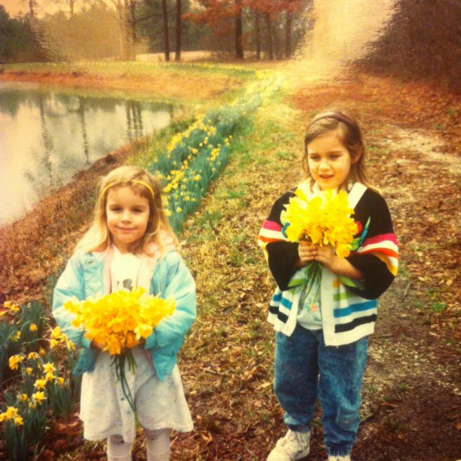 two young girls picking jonquils