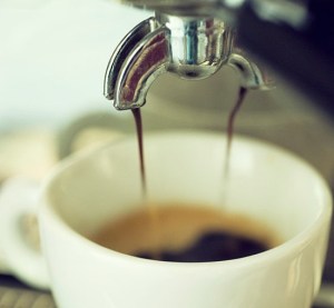 espresso pouring into white mug